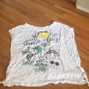White tee with little cartoon drawings